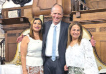 Sisters Martha (left) and Dora with Missionary Mike Hartman at St. George Lutheran Church in London.