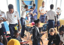 kids grabbing books and reading